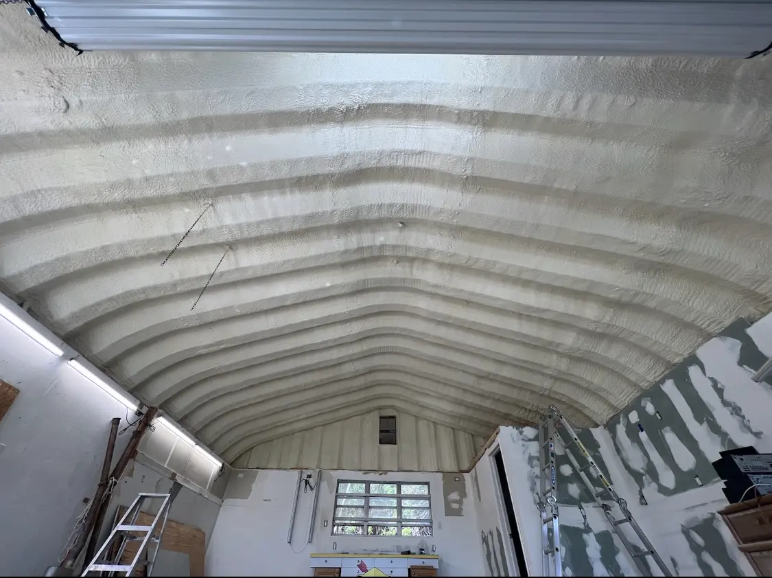 Spray polyurethane foam applied to the underside of a metal roof deck in Burr Ridge